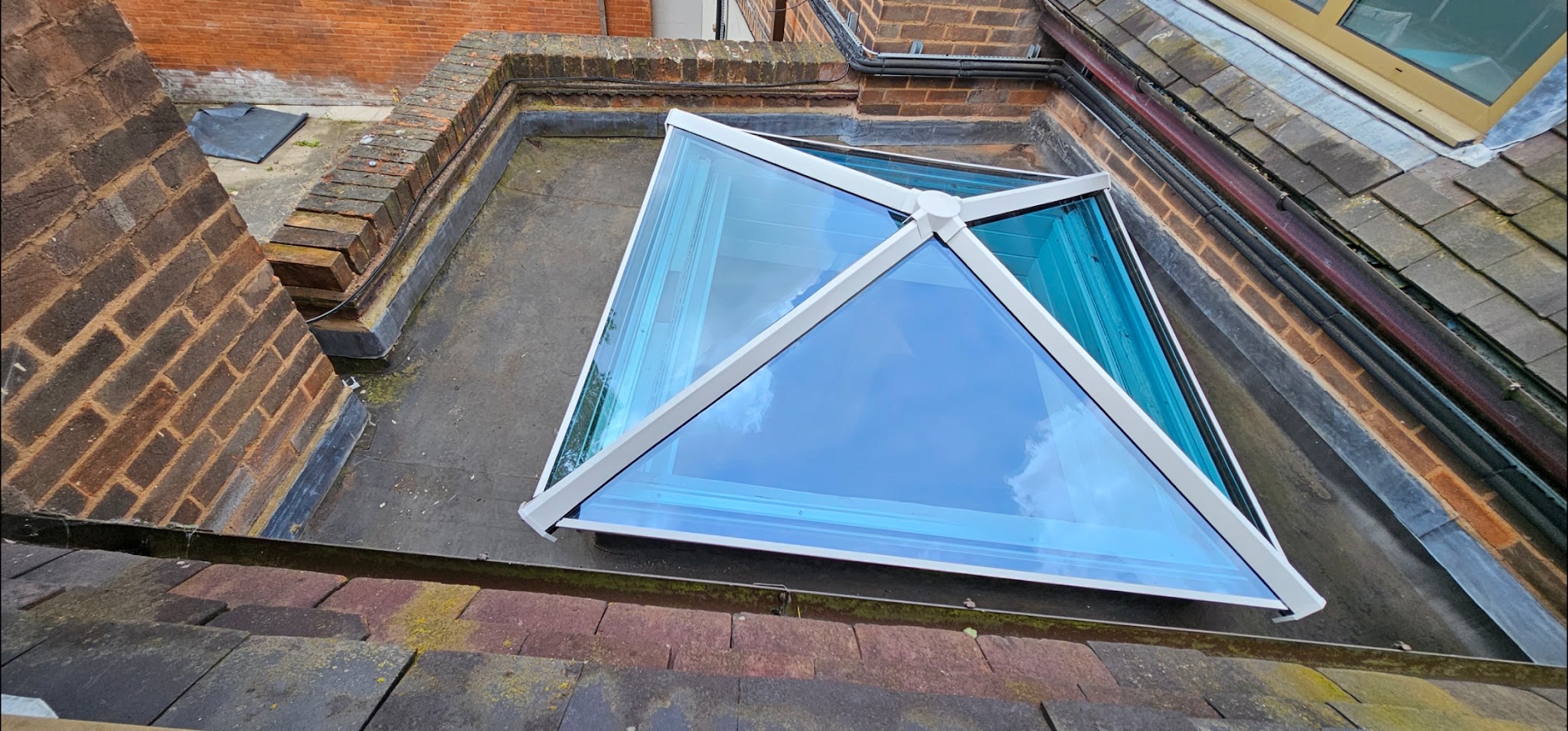 A finished flat roof with a lantern roof light, seen from above